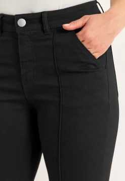 Elastiske crop jeans med syet pressefold