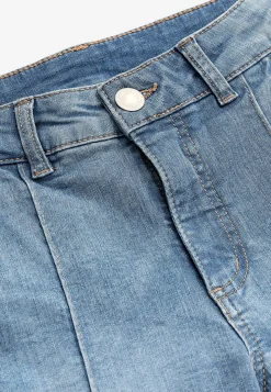 Elastiske crop jeans med syet pressefold