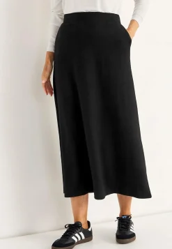 Jerseynederdel med svaj med lommer