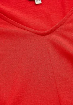 Jerseytunika med flatterende læg